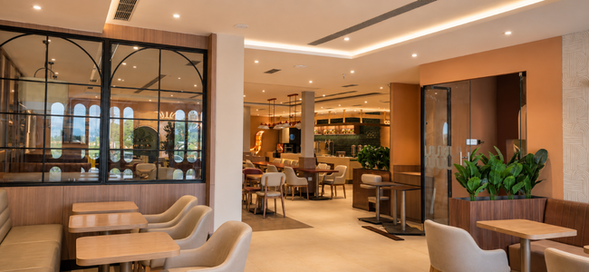 Polished, finished restaurant lounge with warm lighting and consistent branded finishes